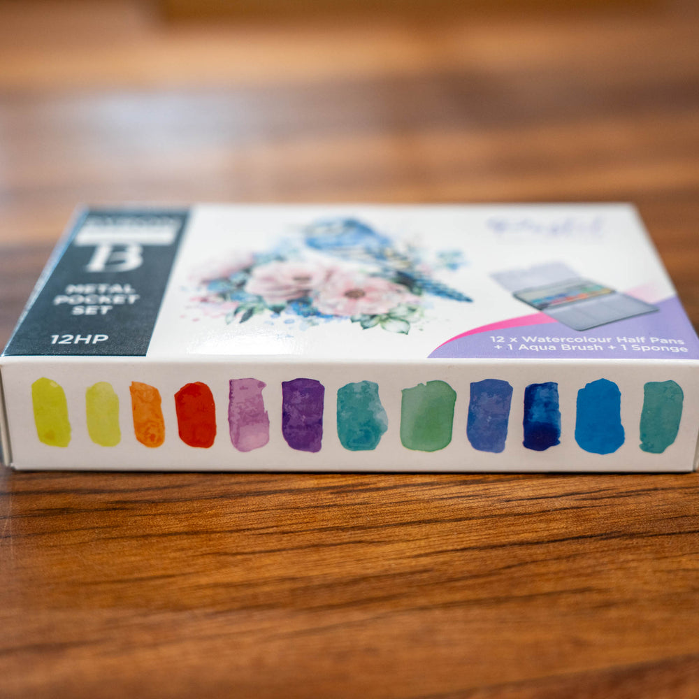 SEA Gallery Pastel Watercolour Pocket Set with soft, muted color swatches arranged on a wooden table.