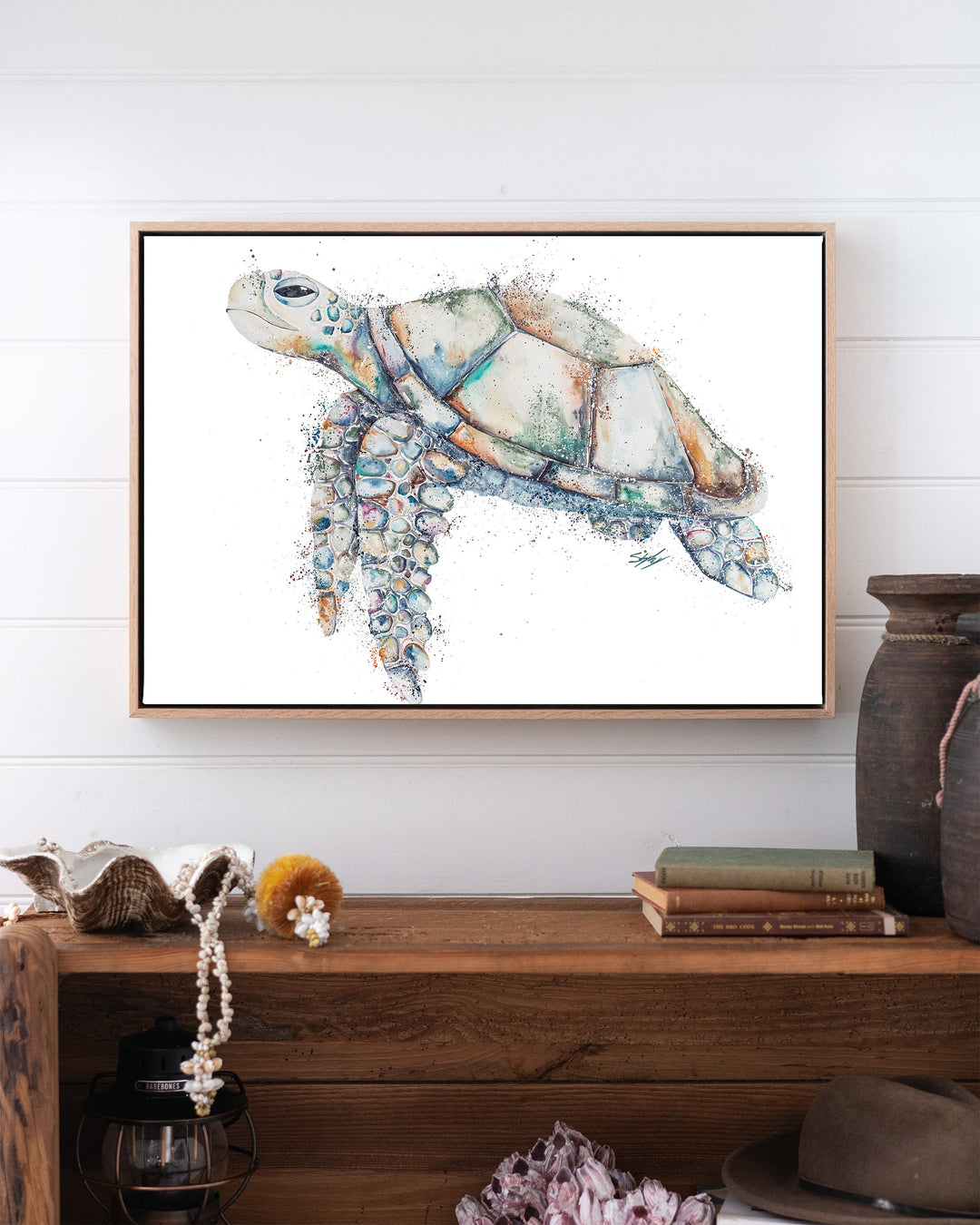 Patchwork – sea turtle, framed canvas in oak float frame, styled above a timber console