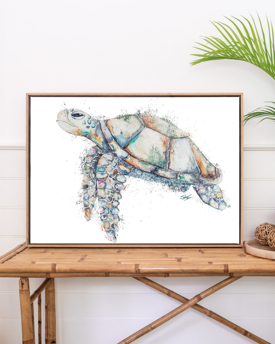 Patchwork – sea turtle, framed canvas in oak float frame, styled on a rattan table