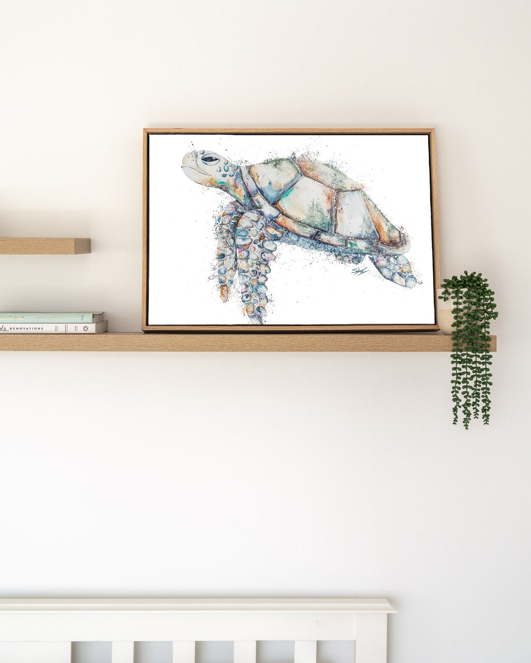 Patchwork – sea turtle, framed canvas in oak float frame, styled on a floating shelf