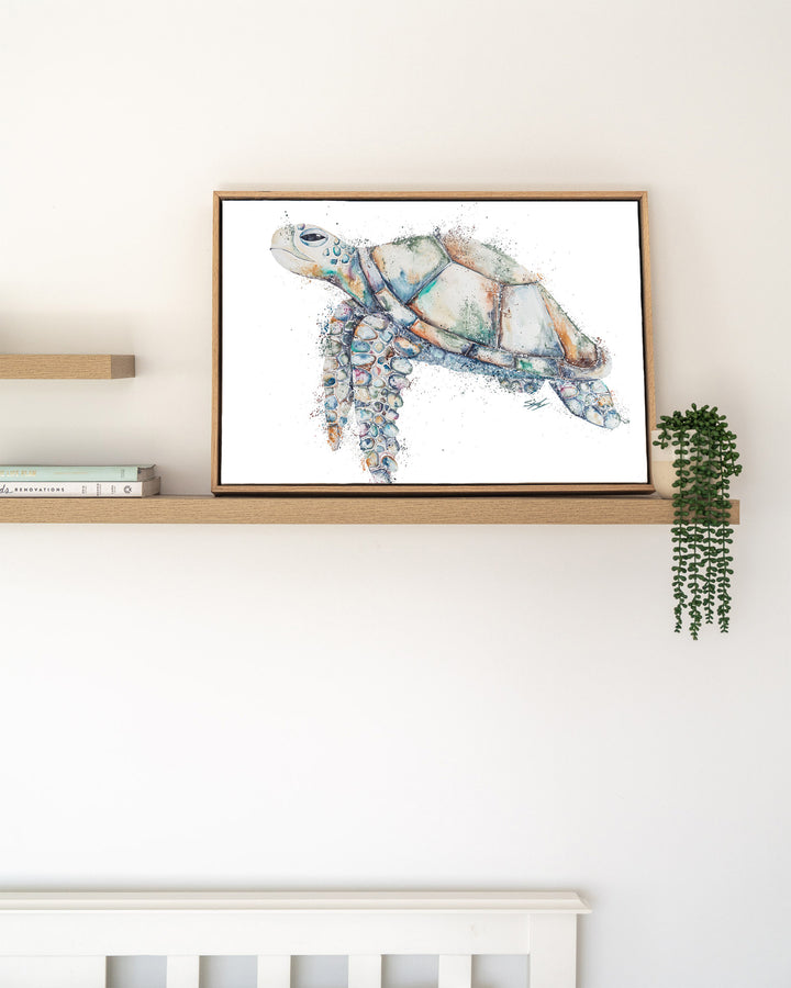 Patchwork – sea turtle, framed canvas in oak float frame, styled on a floating shelf