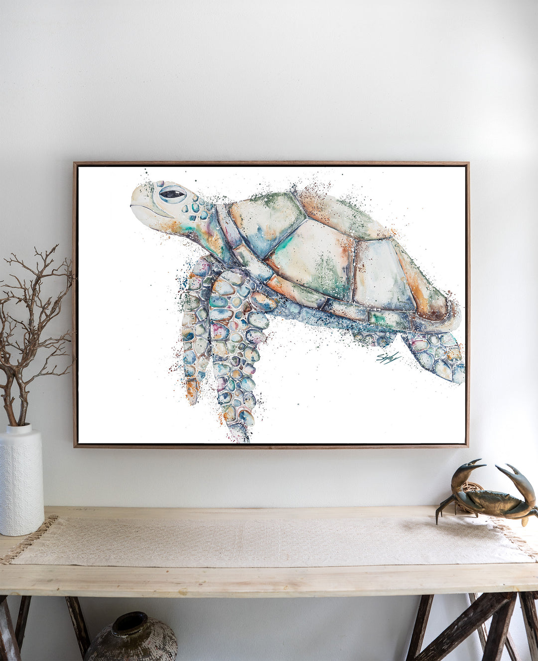 Patchwork – sea turtle, framed canvas in oak float frame, styled above a side table