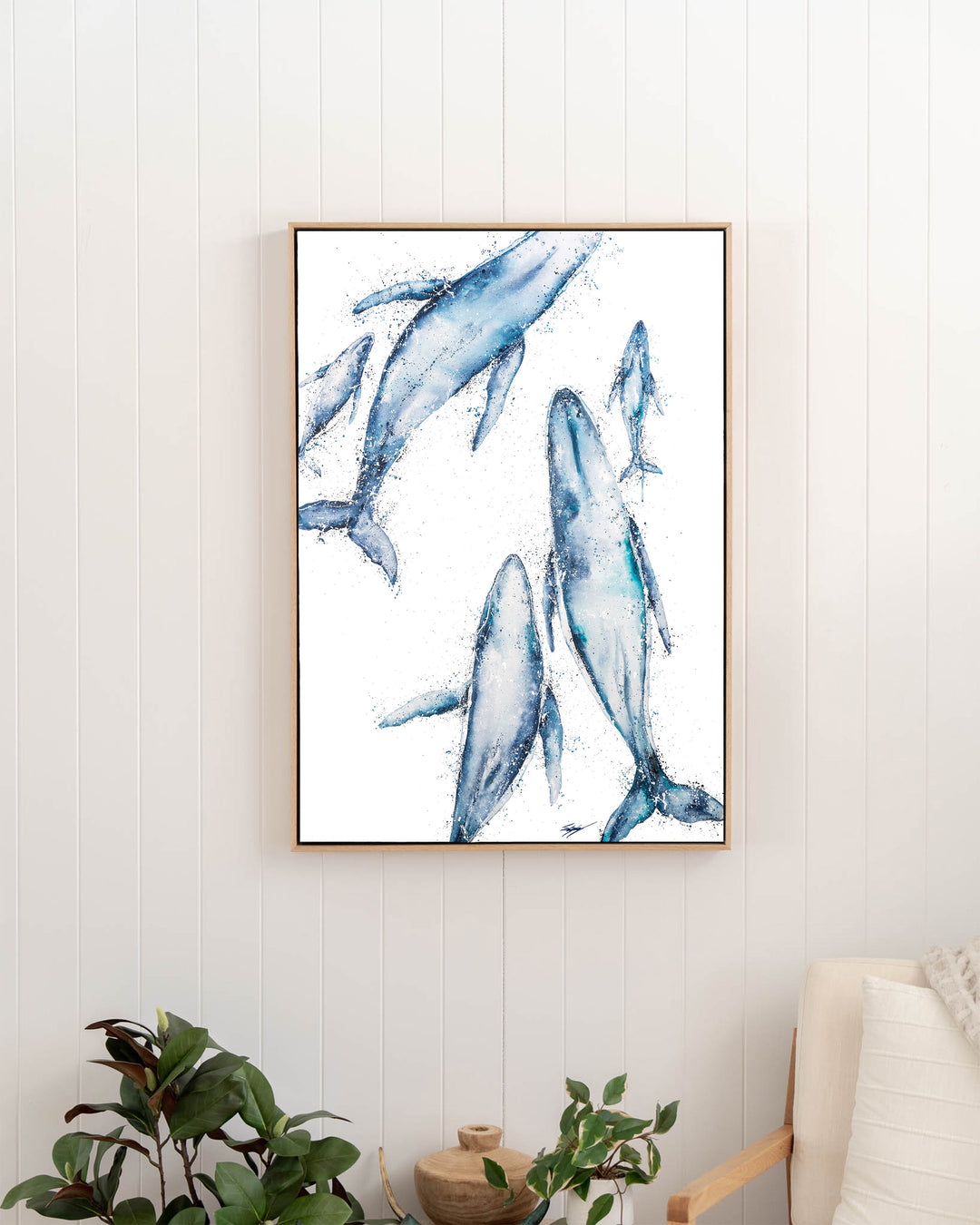 Paving The Way – humpback whales, framed canvas in oak float frame, styled in a hallway