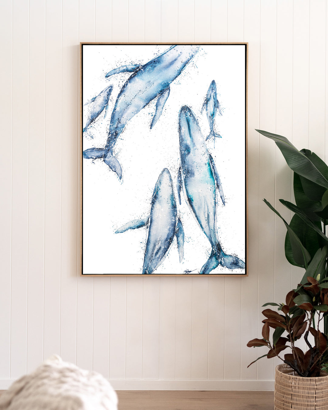 Paving The Way – humpback whales, framed canvas in oak float frame, styled in a living room