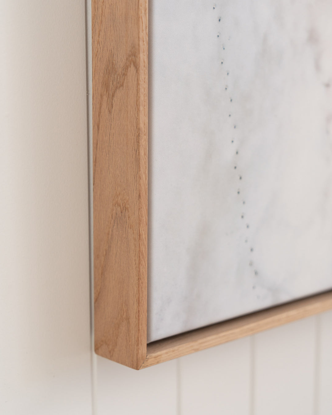 Pearls and Pelicans | Stradbroke Island framed print by David Lloyd on white-paneled wall.