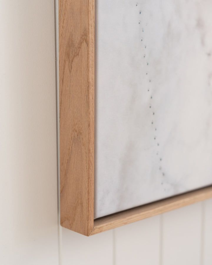 Pearls and Pelicans | Stradbroke Island framed print by David Lloyd on white-paneled wall.