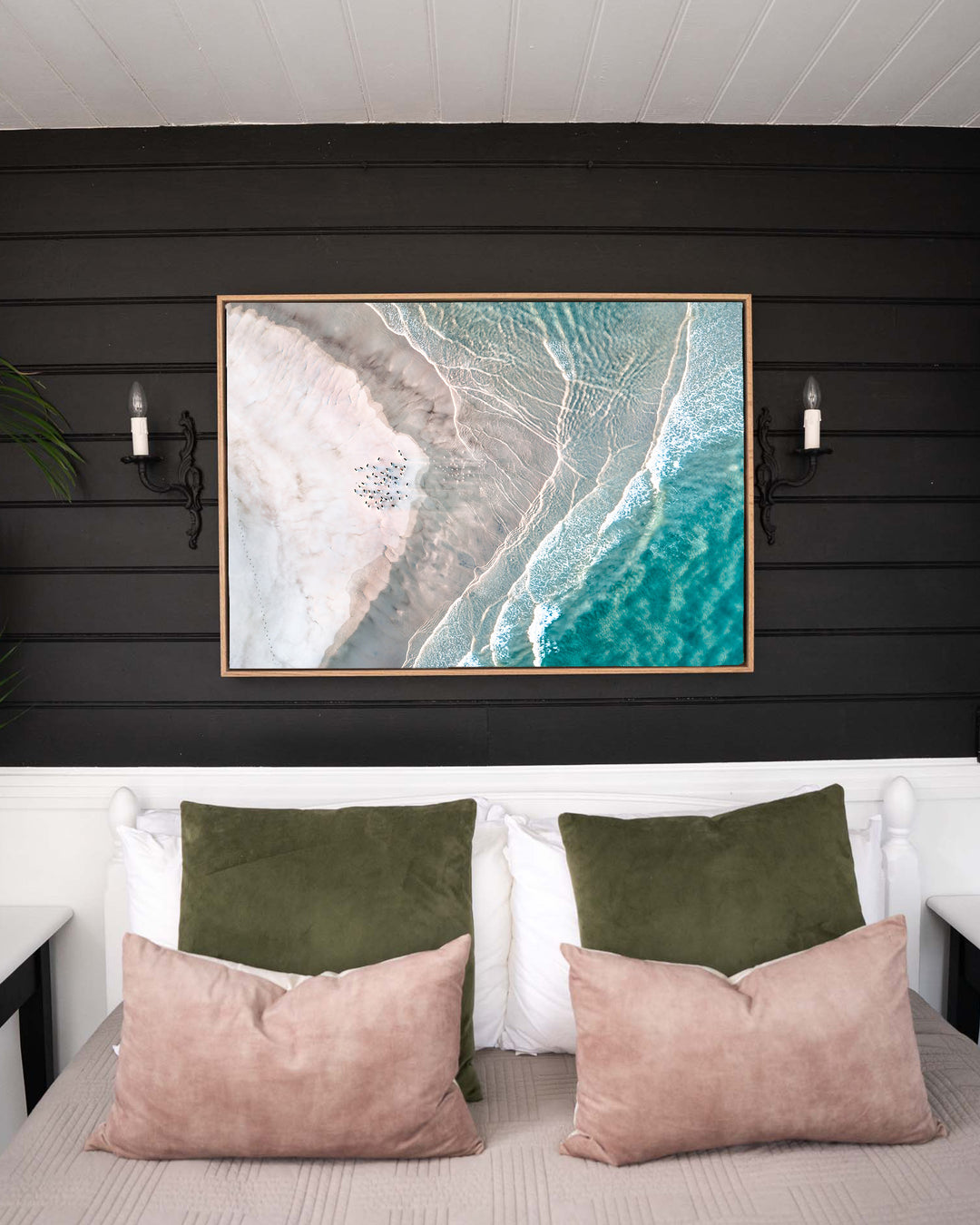 Pearls and Pelicans – Stradbroke Island, Aerial Photography by David Lloyd, framed canvas print in oak float frame, styled in a bedroom setting
