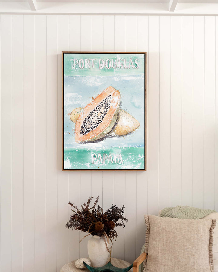 Port Douglas Papaya – tropical still life of papaya, framed canvas in oak float frame, styled in a bedroom