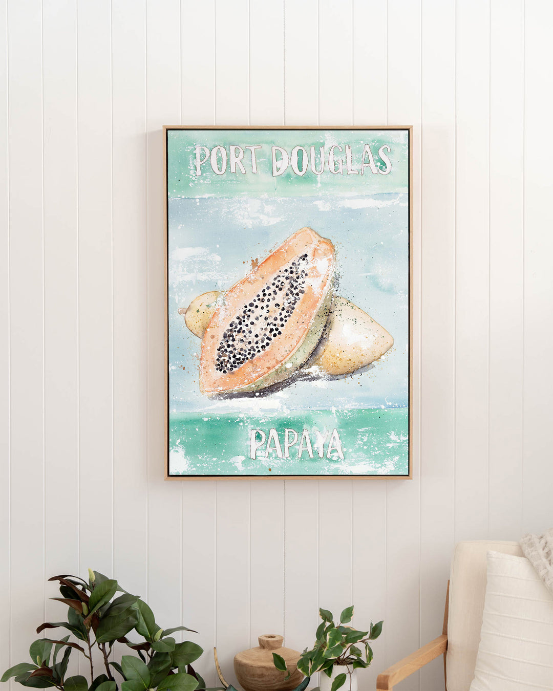 Port Douglas Papaya – tropical still life of papaya, framed canvas in oak float frame, styled in a hallway