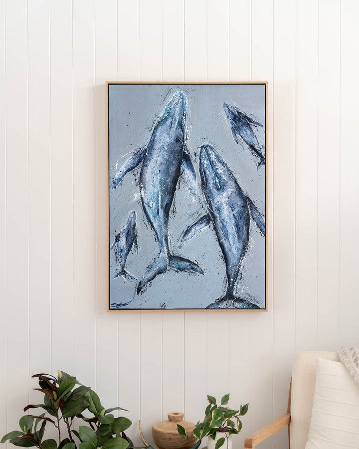 Raise Them on Rhythm and Blues – humpback whales, framed canvas in oak float frame, styled in a hallway