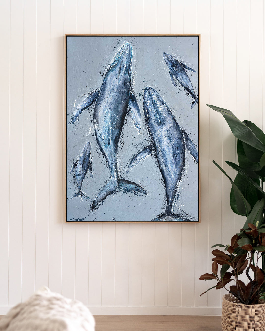 Raise Them on Rhythm and Blues – humpback whales, framed canvas in oak float frame, styled in a living room