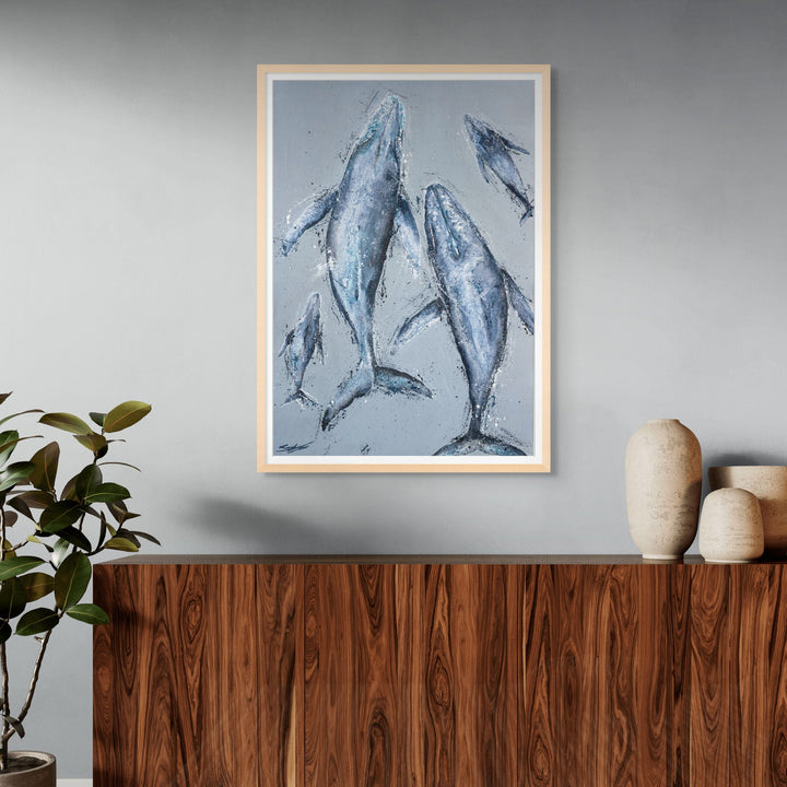 Raise Them on Rhythm and Blues – textured whale painting with multiple whales drifting through layered blue ocean tones by Stephanie Elizabeth | Framed Paper Print