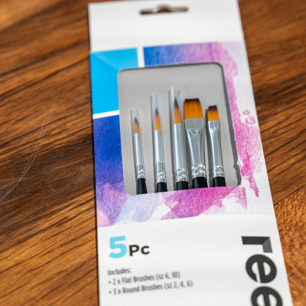 SEA Gallery 5 Piece Brush Set packaged in a white and purple box, displayed on a wooden surface.