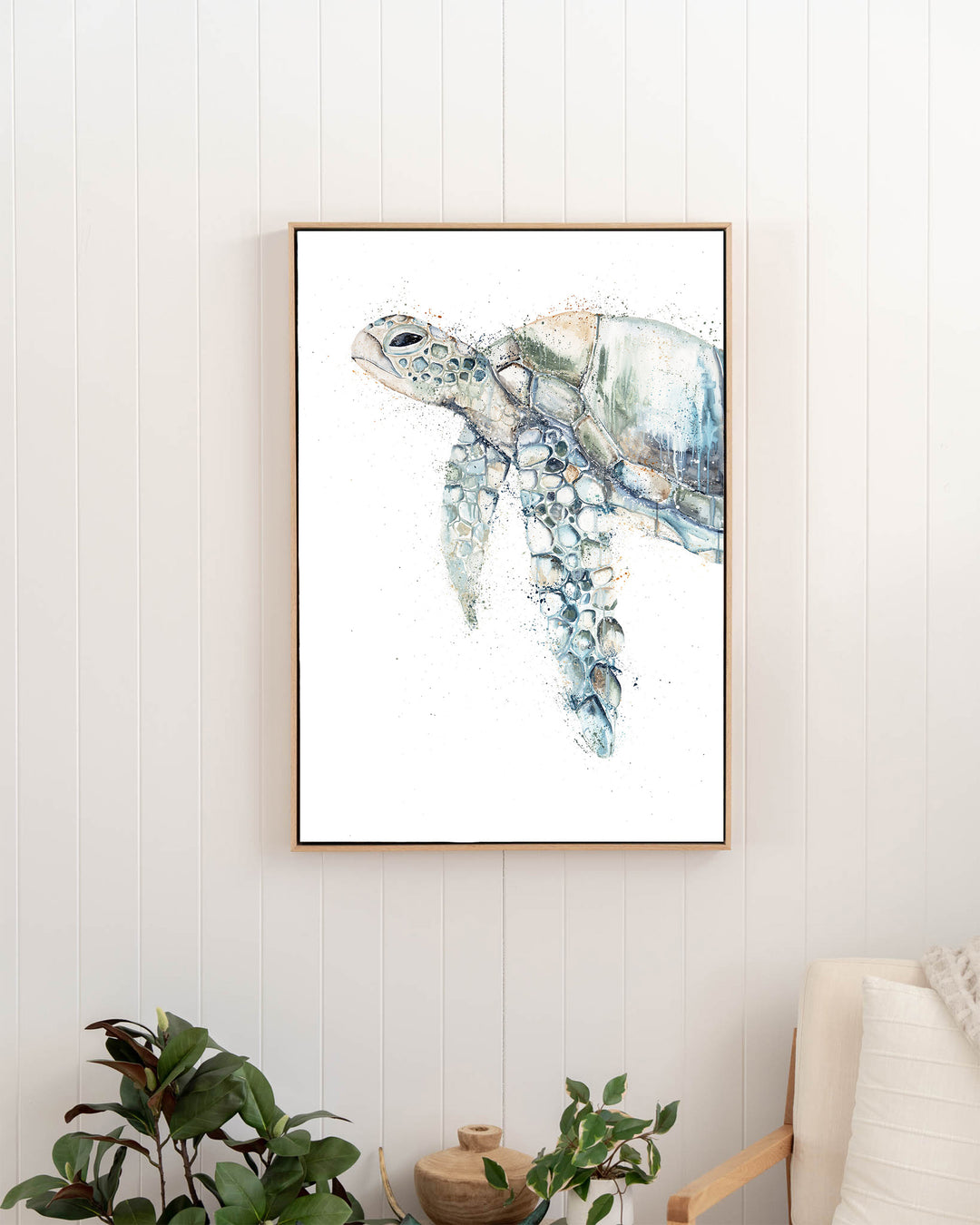 Renegade – green sea turtle, framed canvas in oak float frame, styled in a hallway