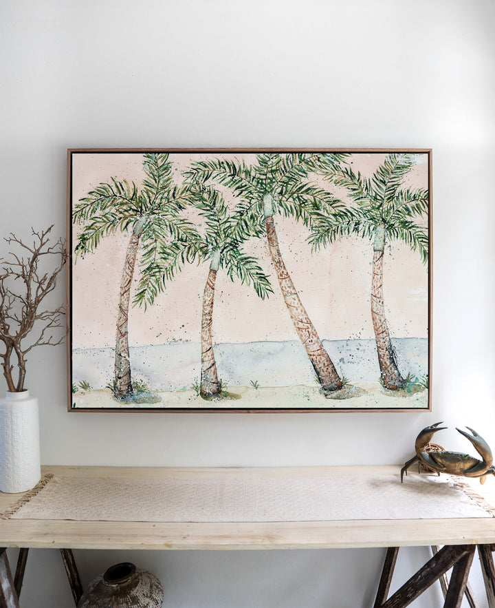 Rex Smeal Serenade – palm trees at Rex Smeal Park, Port Douglas, framed canvas in oak float frame, styled above a side table