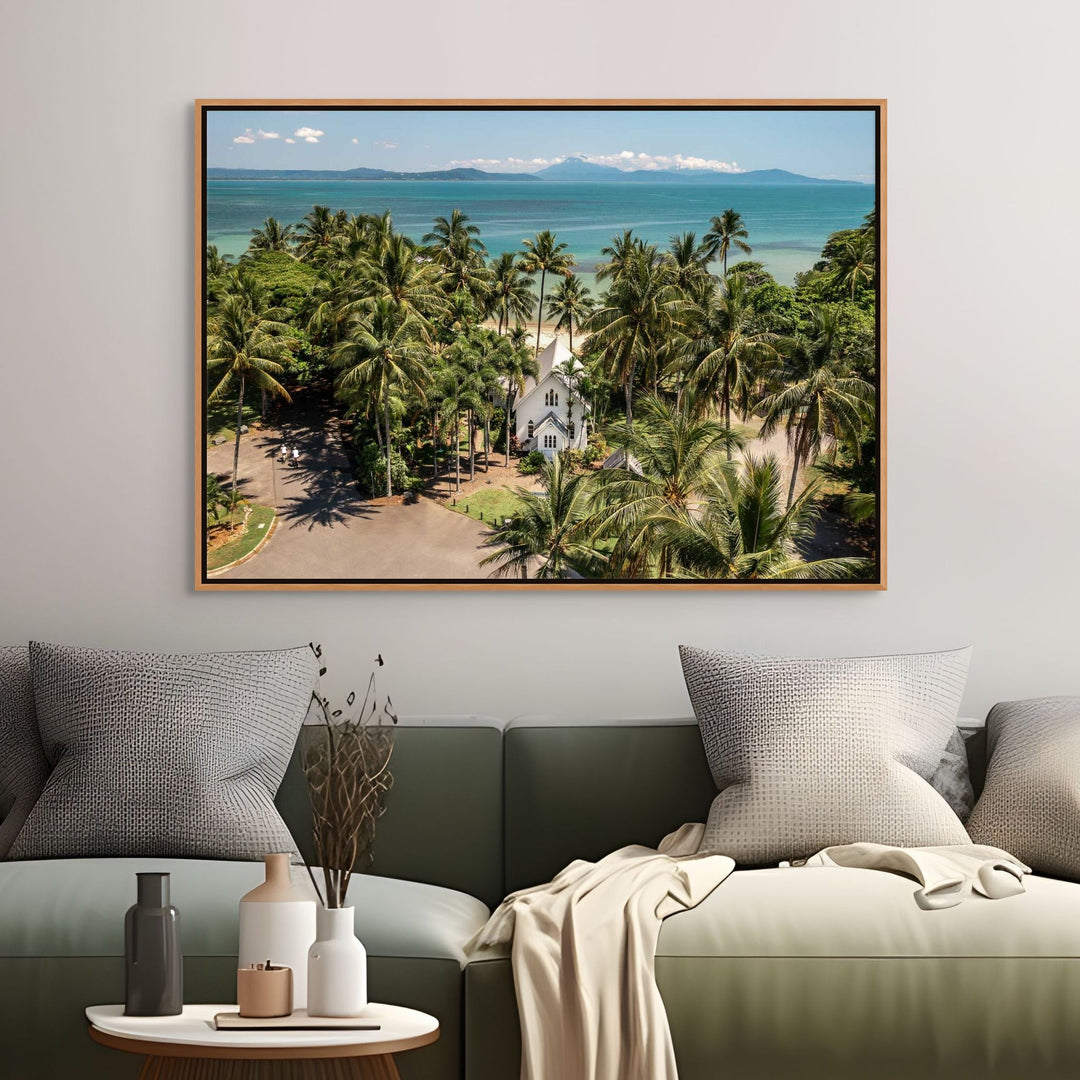 Rolling to the Seaside – Aerial view over St Mary’s, Port Douglas on a perfectly flat day with tropical waters, blue skies, and distant mountains | Shadow Box Canvas Print