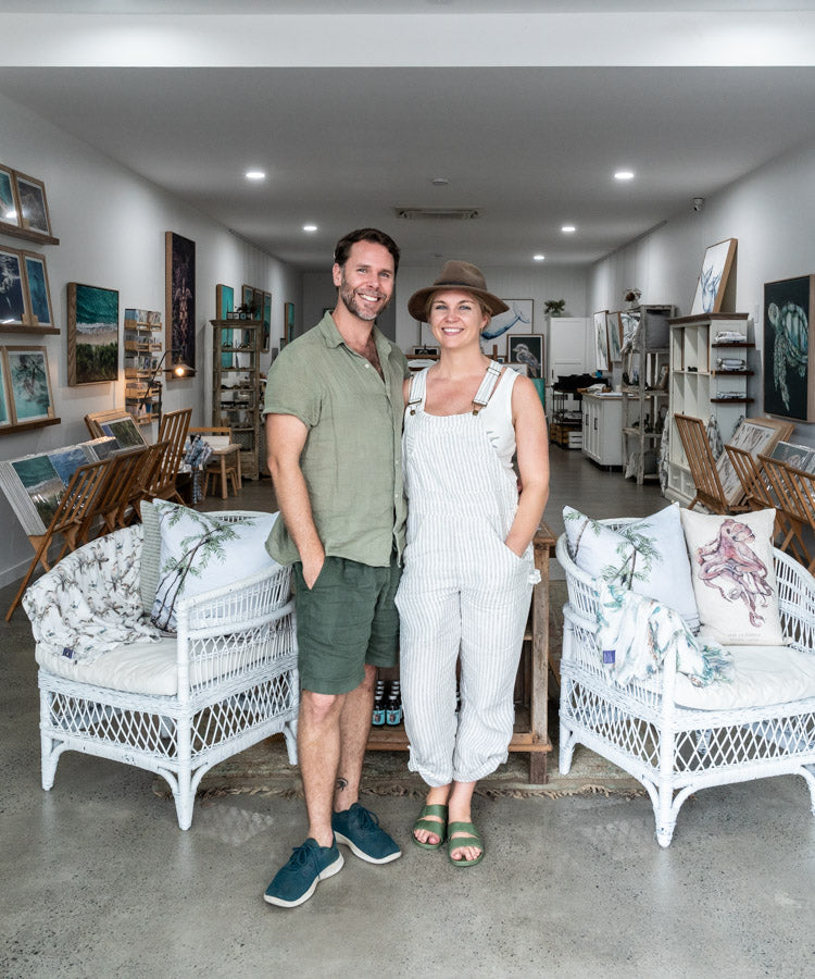 SEA Gallery – Stephanie Elizabeth and David Lloyd standing together in gallery, smiling, warm lighting, artworks in background | Mobile Banner