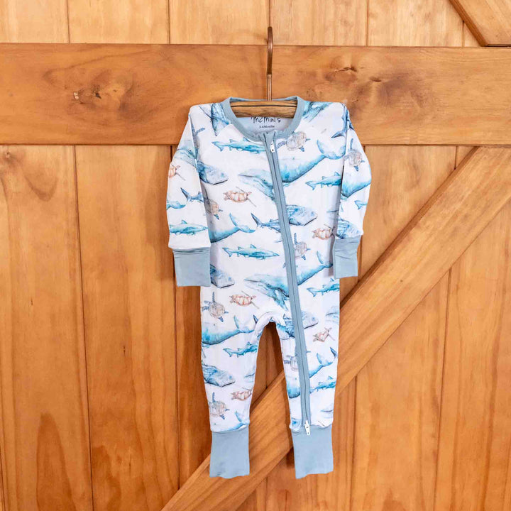 Sea Life Baby Onesie – humpback whale, turtles, sharks - hanging full view