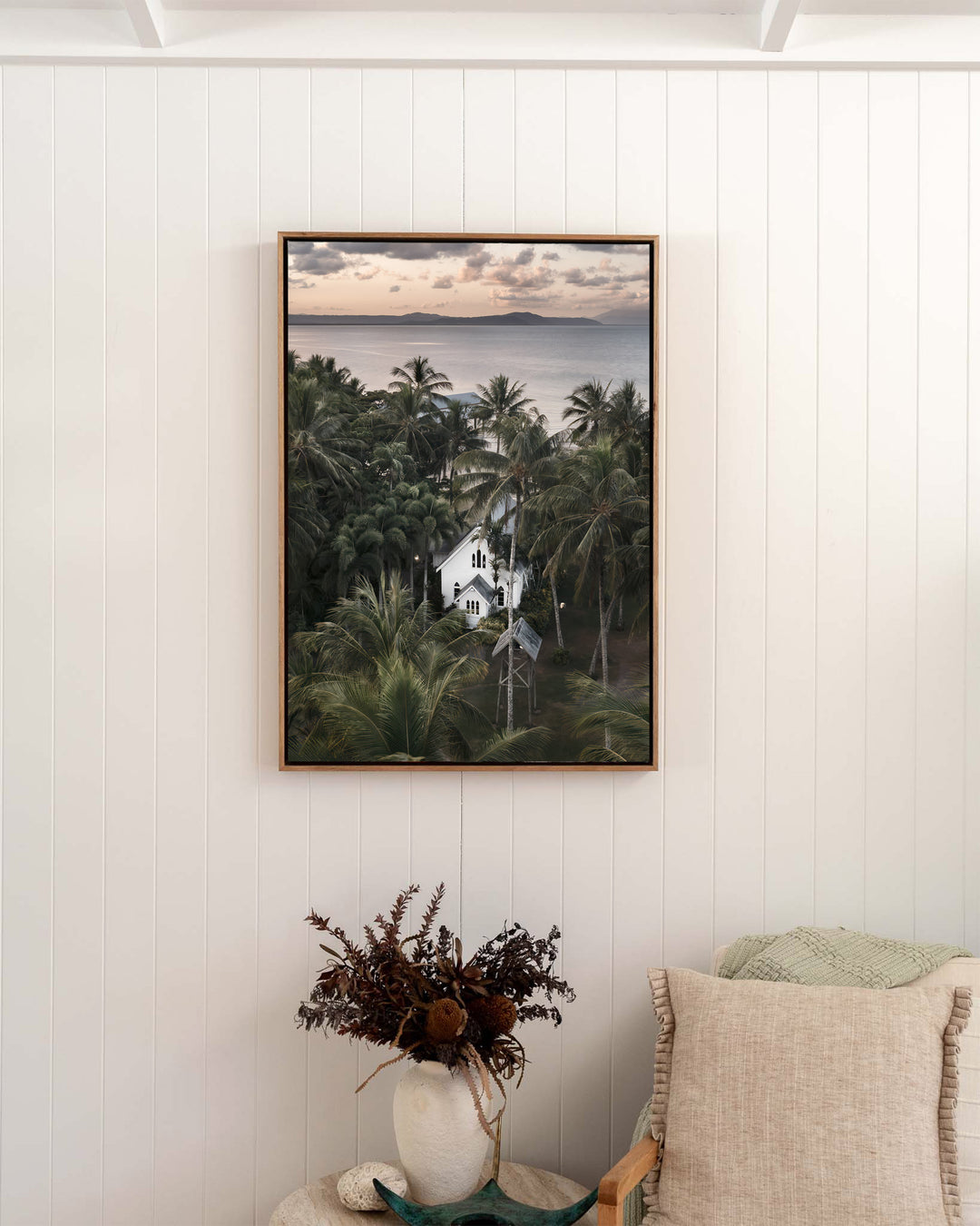 So Easy To Fall In Love – St Mary’s Chapel, Coastal Photography by David Lloyd, framed canvas print in oak float frame, styled in a bedroom setting