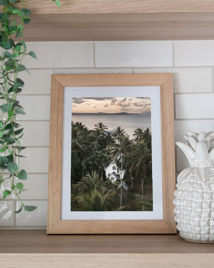 So Easy To Fall In Love – St Mary’s Chapel, Coastal Photography by David Lloyd, framed paper print in oak frame, styled in a kitchen shelf setting
