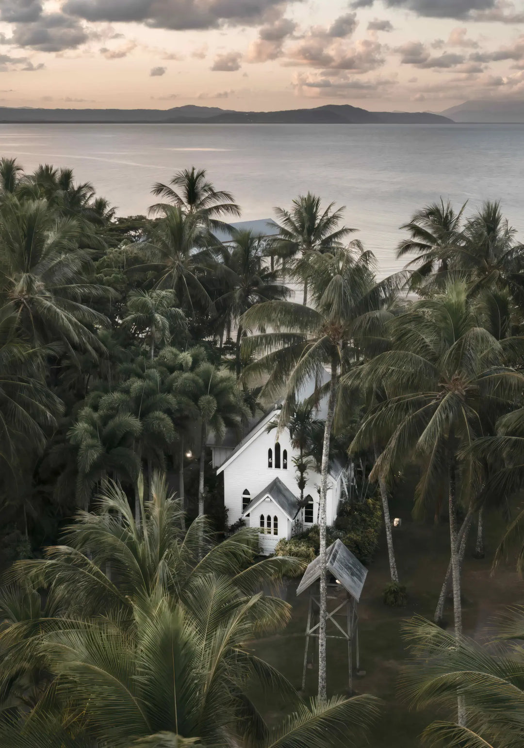 So Easy To Fall In Love – moody coastal photograph of St Mary’s Chapel in Port Douglas surrounded by tropical palms and ocean horizon | Unframed Rolled Print