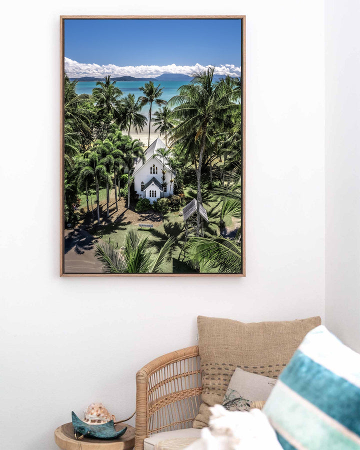 Framed aerial photograph of Always Forever | St Mary’s, Port Douglas, showing the church surrounded by palms and the ocean.