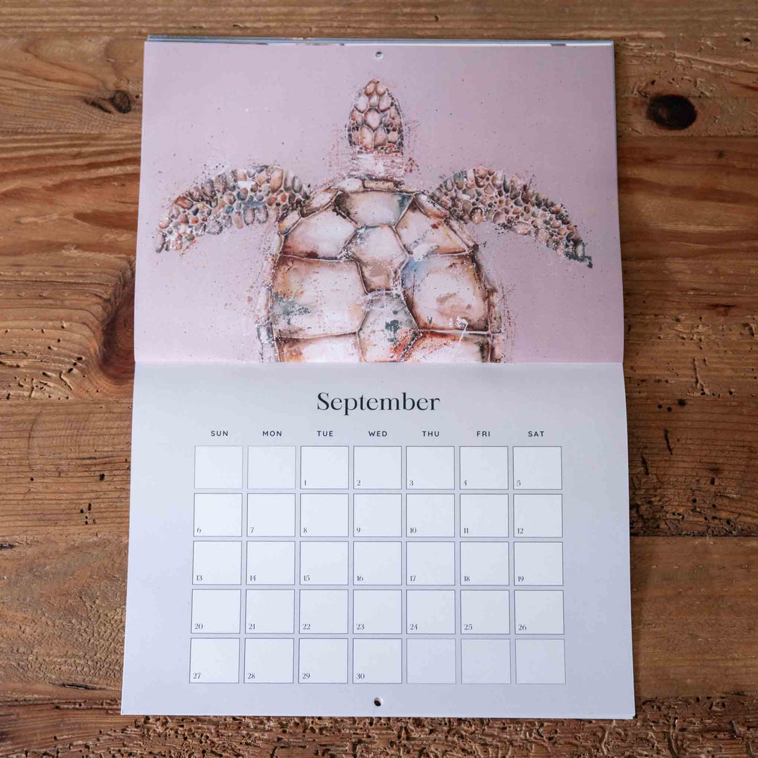 Calendar with a turtle design on a wooden surface