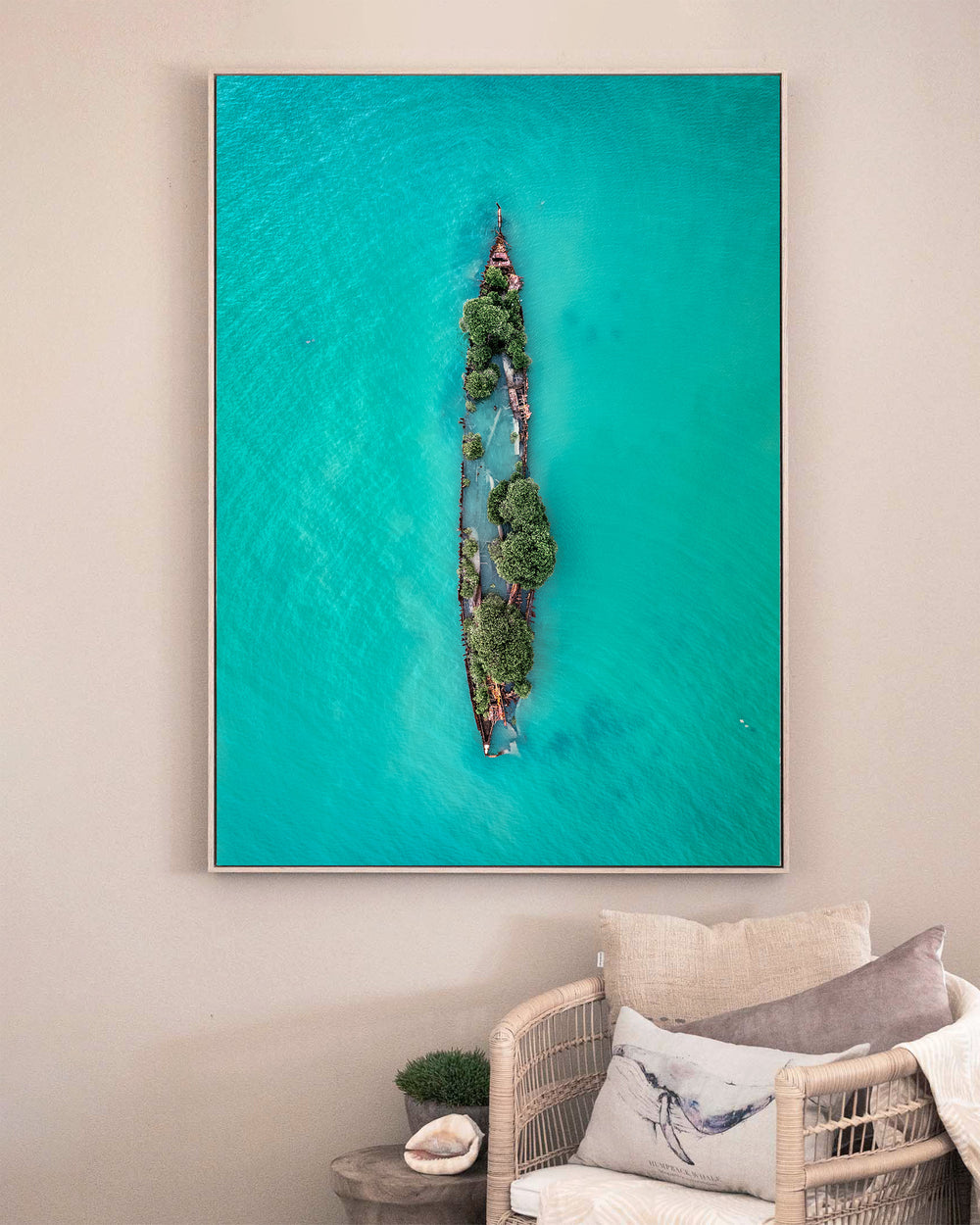 Sunken Solitude – Magnetic Island Shipwreck, Aerial Photography by David Lloyd, framed canvas print in oak float frame, styled in a sitting room setting
