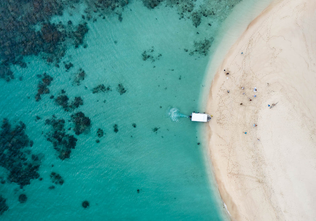 Take me to the Cay – Aerial view of Mackay Cay and Undine Reef with vibrant aqua waters and reef detail | Unframed Rolled Print