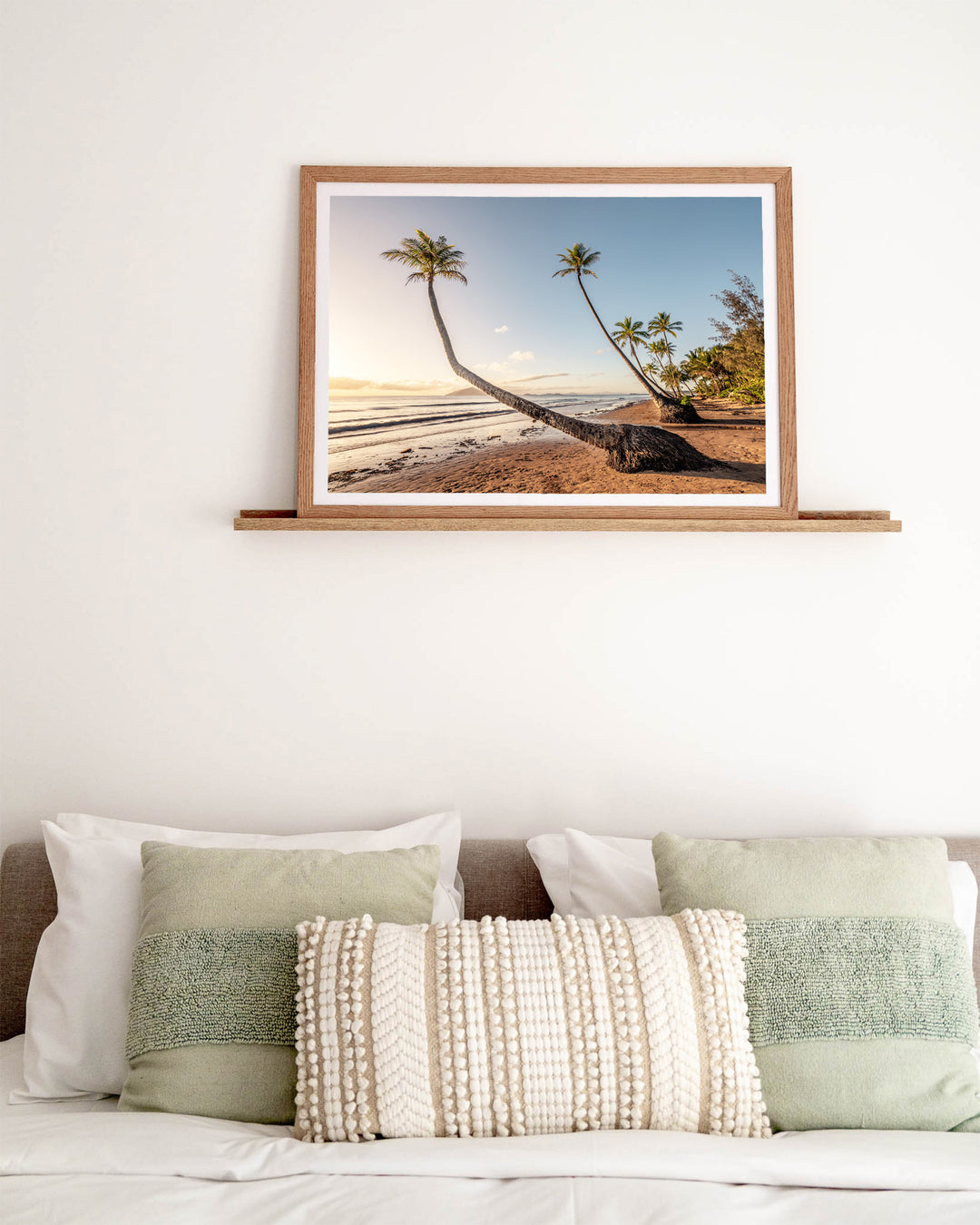 Taken with the Tide – Mission Beach, Landscape Photography by David Lloyd, framed paper print in oak frame, styled in a bedroom setting
