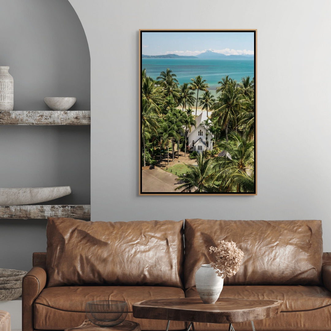 The Art of Loving – bright coastal photograph of St Mary’s Chapel in Port Douglas surrounded by tropical palm trees and ocean backdrop | Shadow Box Canvas Print