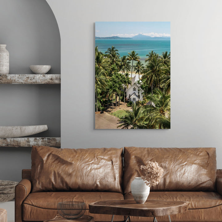 The Art of Loving – bright coastal photograph of St Mary’s Chapel in Port Douglas surrounded by tropical palm trees and ocean backdrop | Stretched Canvas Print