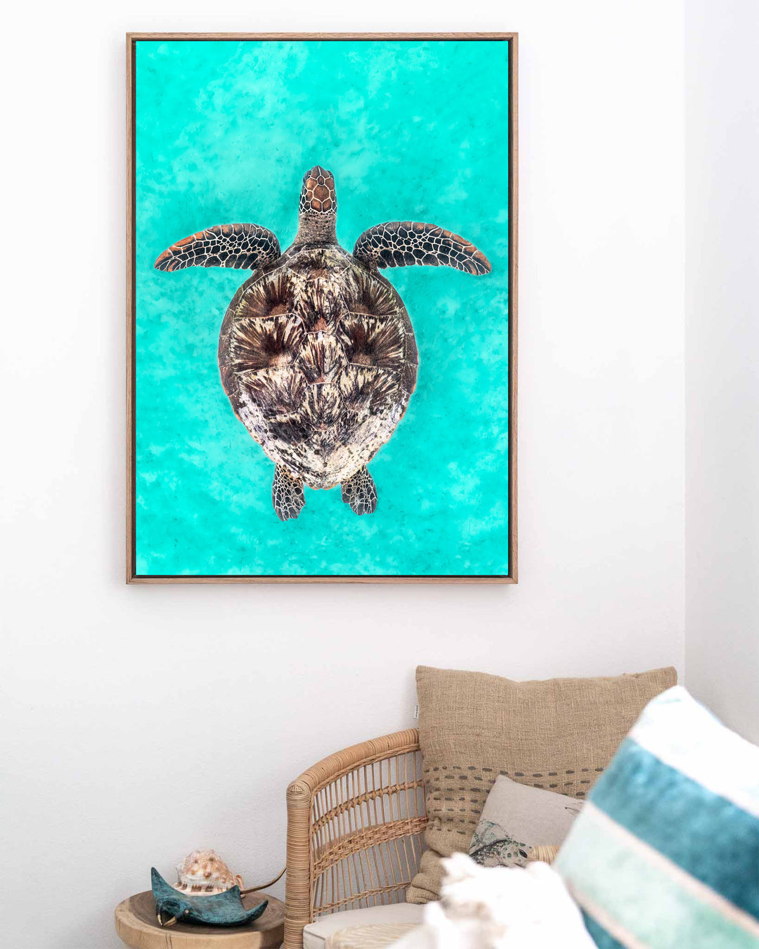 The Passage – Green Sea Turtle, Underwater Photography by David Lloyd, framed canvas print in oak float frame, styled in a coastal lounge setting
