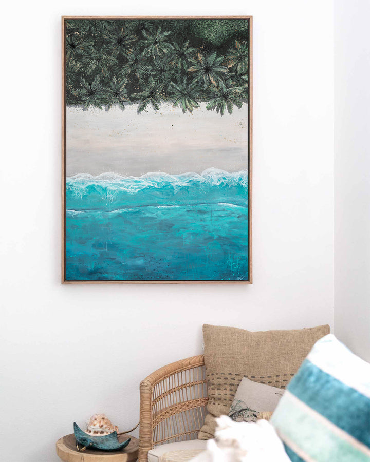 The Path Between – aerial beach and palm landscape, framed canvas in oak float frame, styled in a coastal lounge