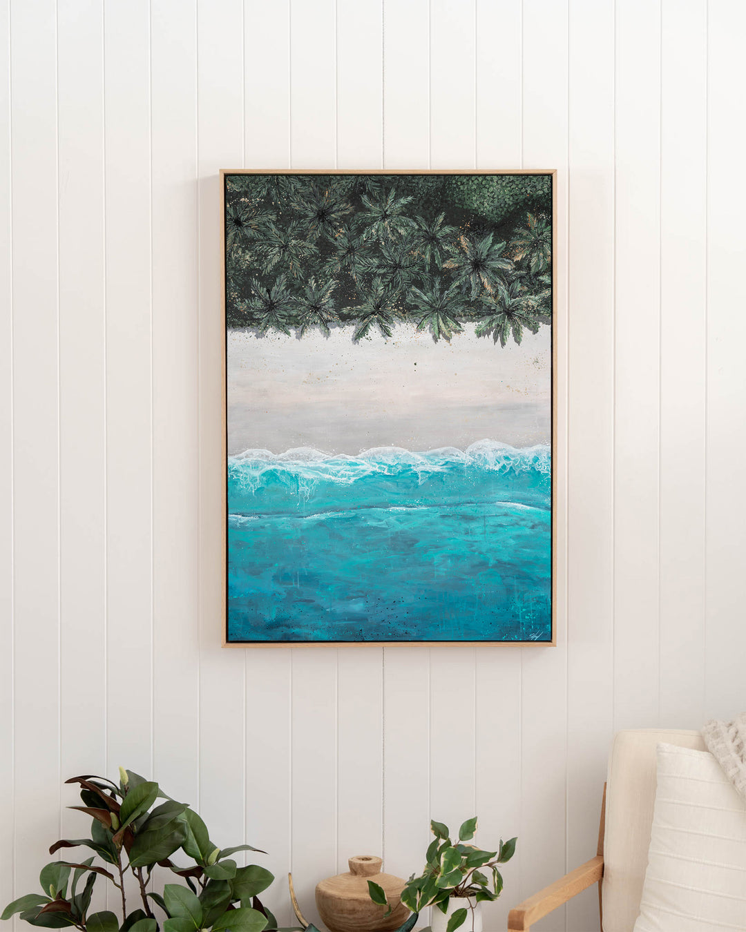 The Path Between – aerial beach and palm landscape, framed canvas in oak float frame, styled in a hallway