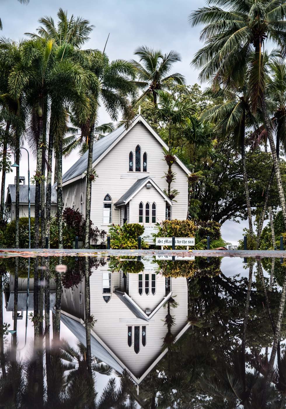 This Too Shall Pass – Mirror-image reflection of St Mary’s Chapel in a puddle, Port Douglas | Unframed Rolled Print