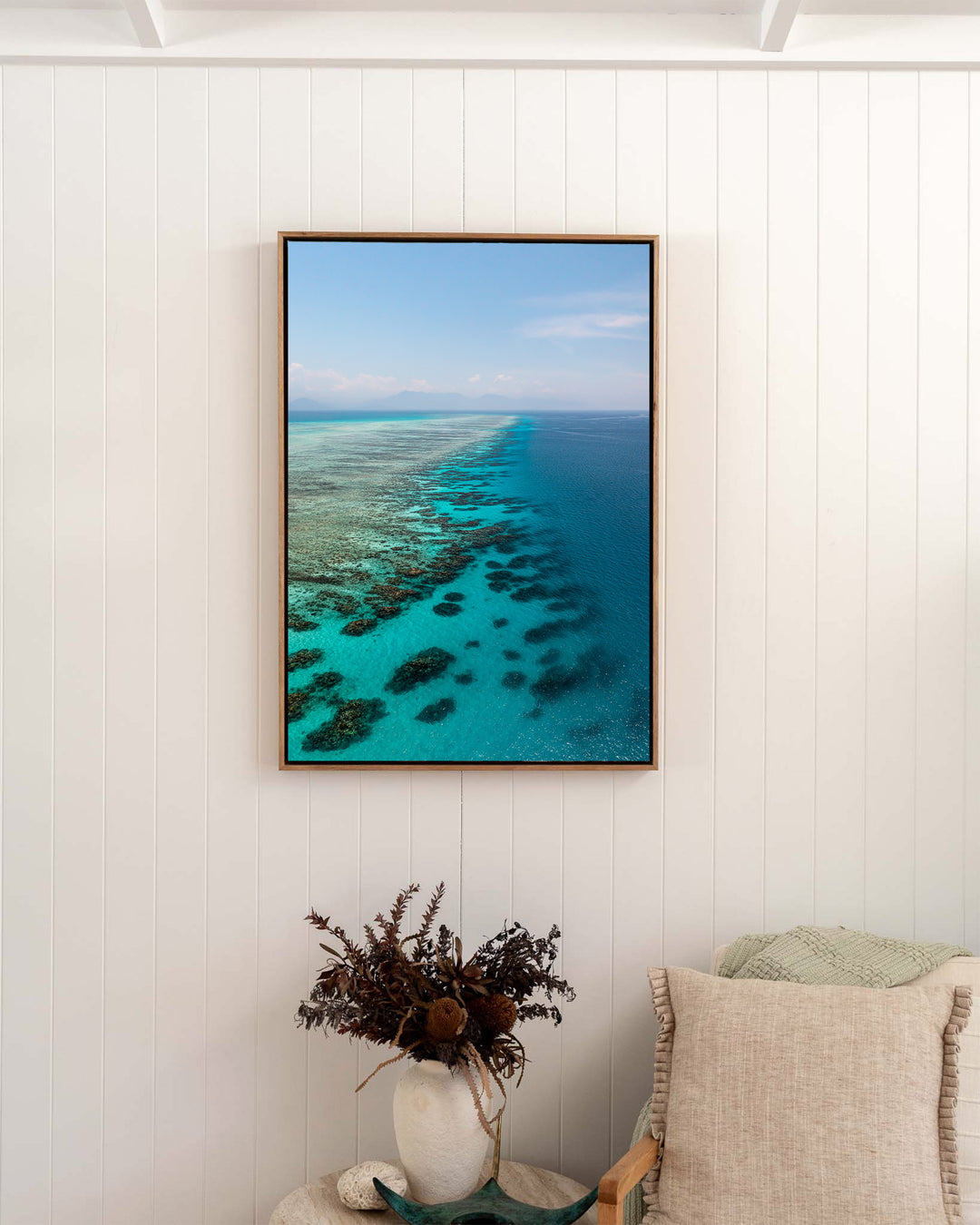 Tip of the Tongue – Tongue Reef, Aerial Photography by David Lloyd, framed canvas print in oak float frame, styled in a bedroom setting