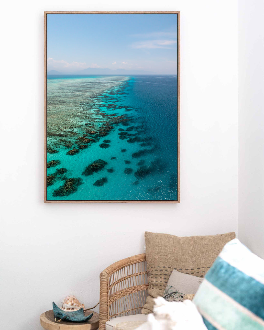 Tip of the Tongue – Tongue Reef, Aerial Photography by David Lloyd, framed canvas print in oak float frame, styled in a coastal lounge setting