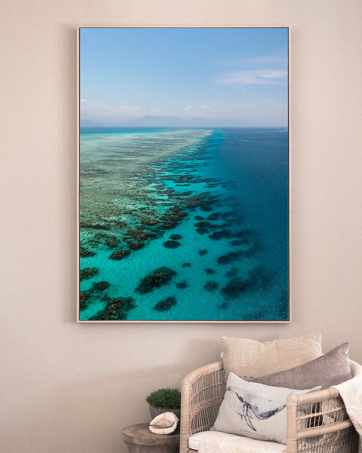 Tip of the Tongue – Tongue Reef, Aerial Photography by David Lloyd, framed canvas print in oak float frame, styled in a sitting room setting