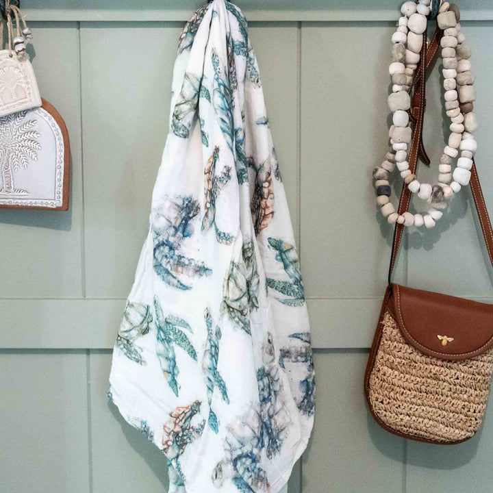 turtle swaddle hanging on wall 