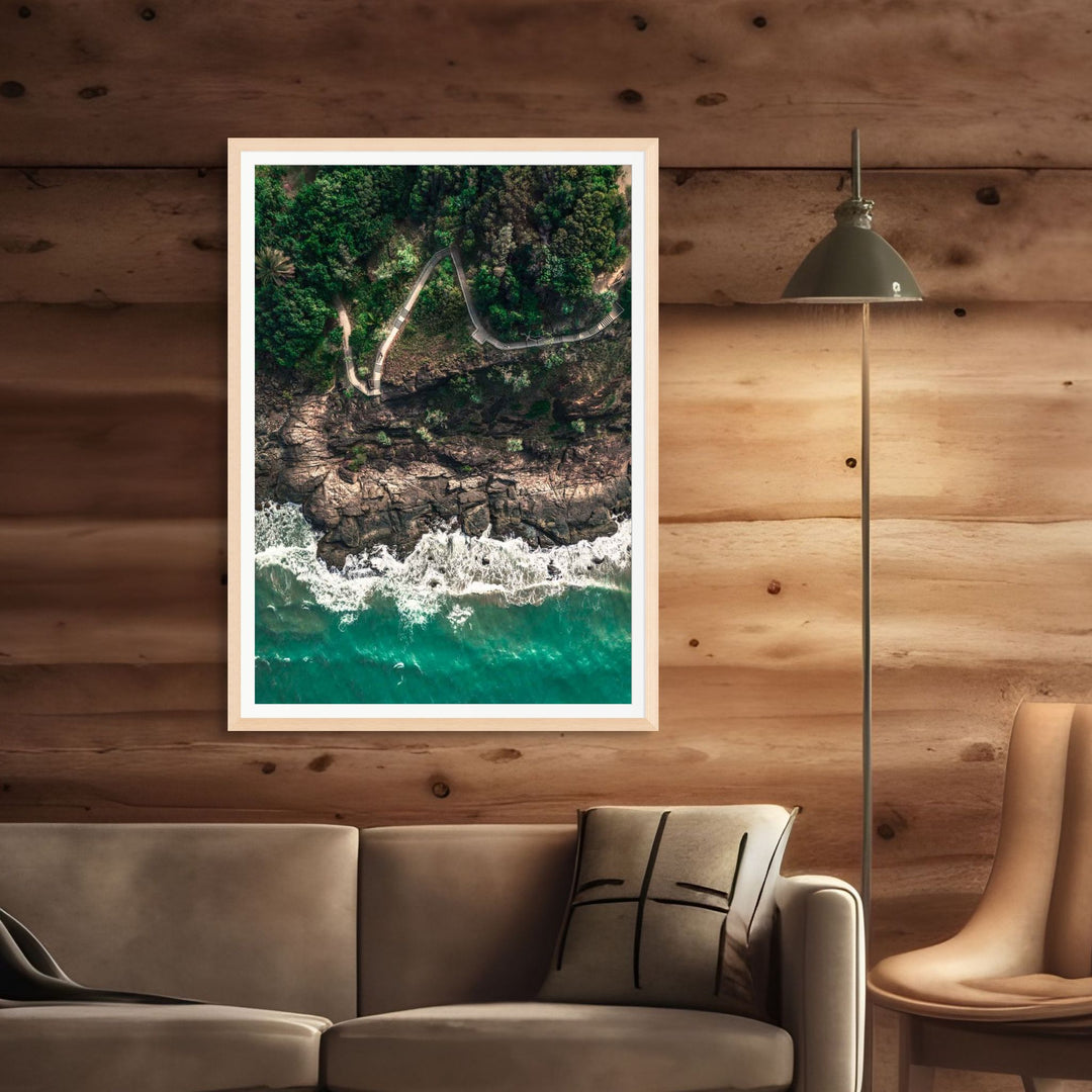 Up and Over – Top-down aerial view of Flagstaff Hill, Port Douglas at first light with pathway and breaking waves | Framed Paper Print by David Lloyd