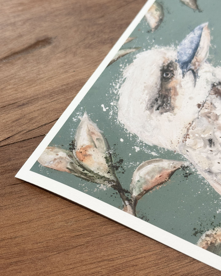 Corner detail of the We Belong Together kookaburra fine art print on a timber surface, showing a kookaburra&