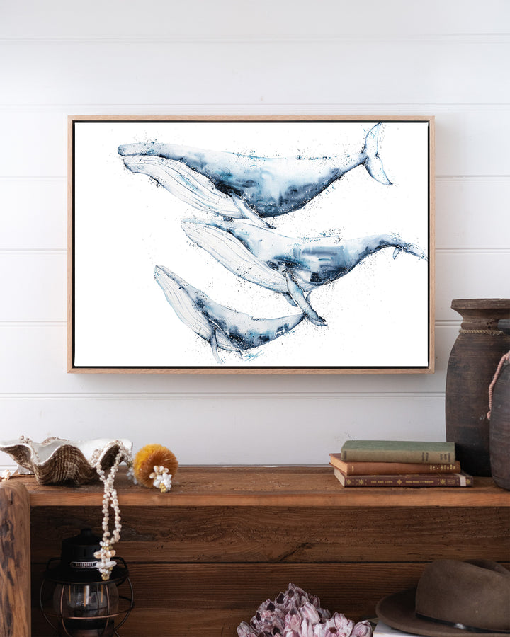 When We Go, We Go Together – humpback whales, framed canvas in oak float frame, styled above a timber console
