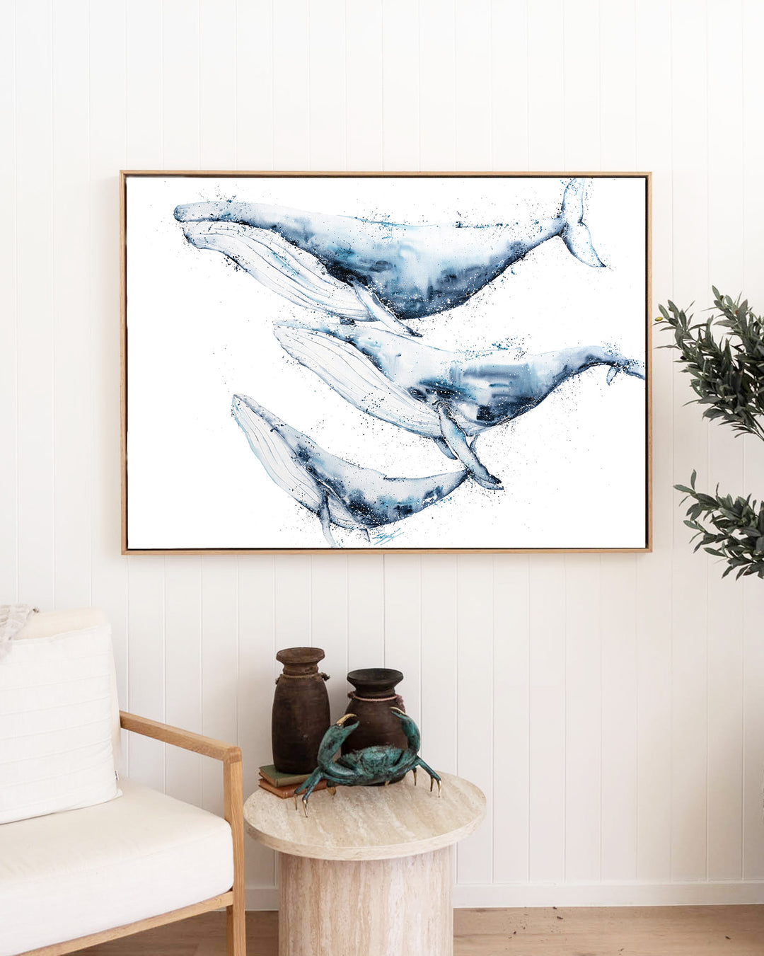 When We Go, We Go Together – humpback whales, framed canvas in oak float frame, styled in a living room