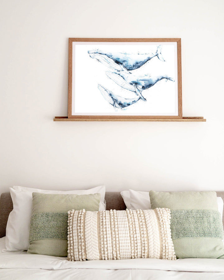 When We Go, We Go Together – humpback whales, framed paper print in oak frame, styled above a bed