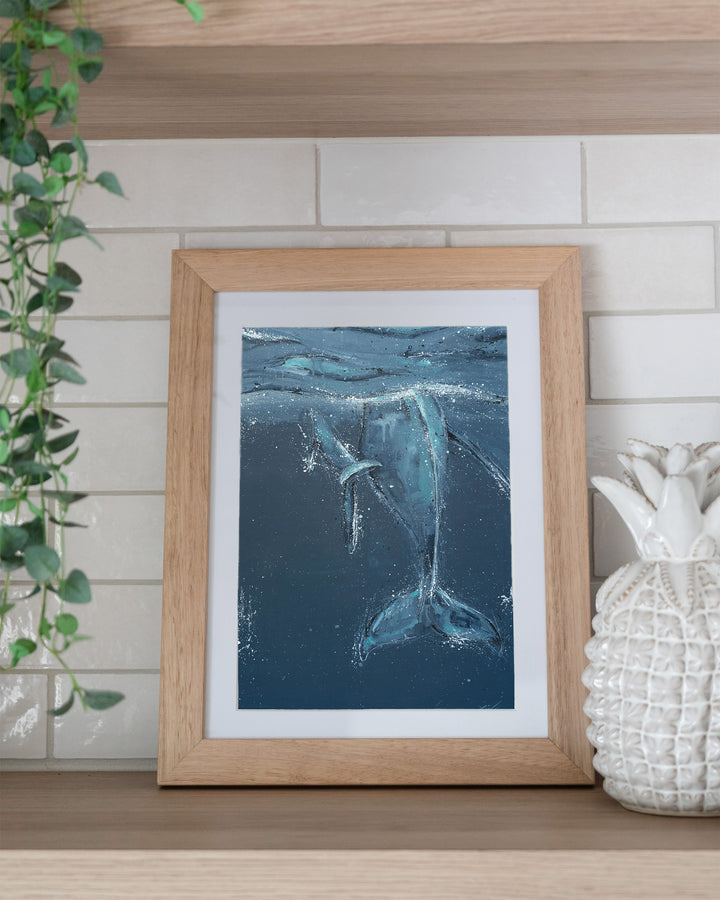 Wherever You Are – whale tails, framed paper print in oak frame, styled on a kitchen shelf