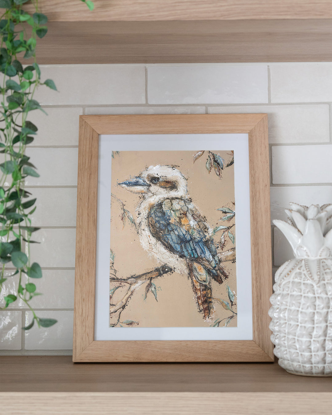 Whittaker – kookaburra, framed paper print in oak frame, styled on a kitchen shelf